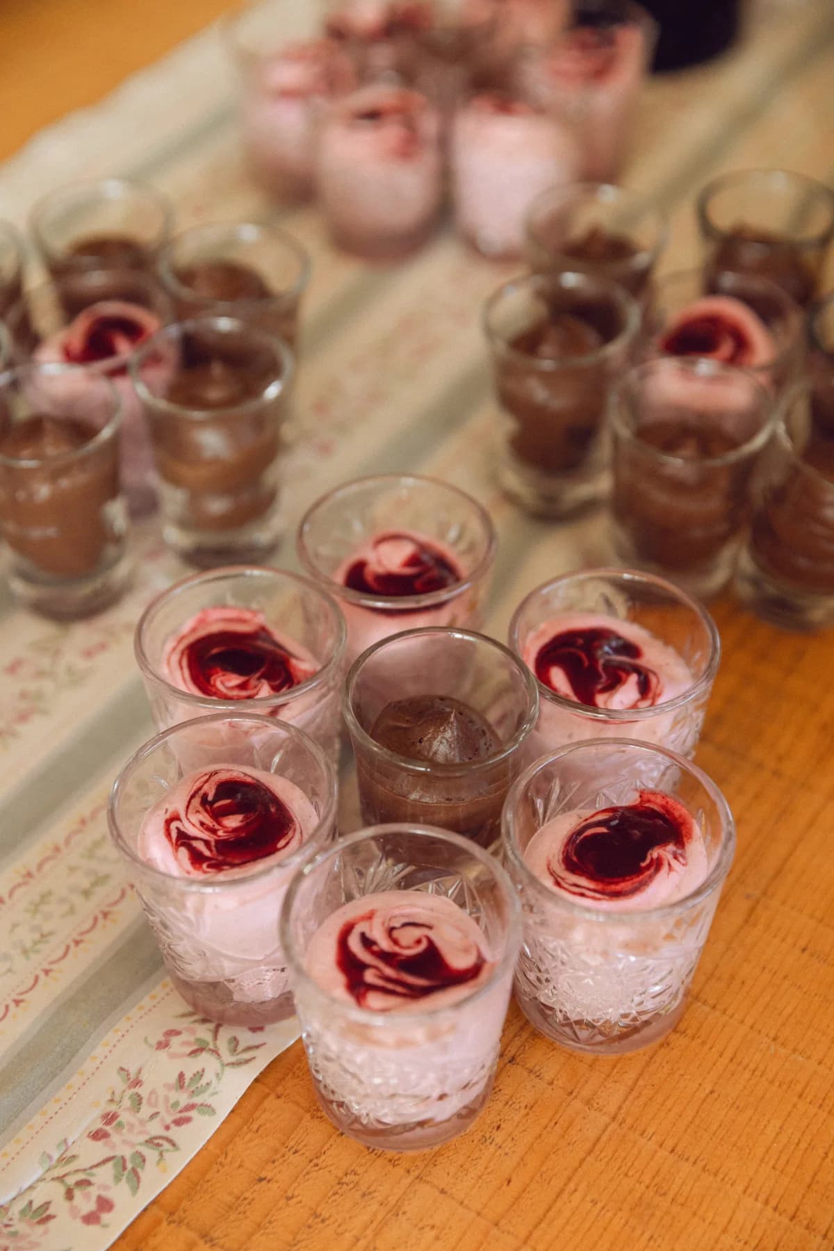 Individual berry desserts arranged on a buffet table