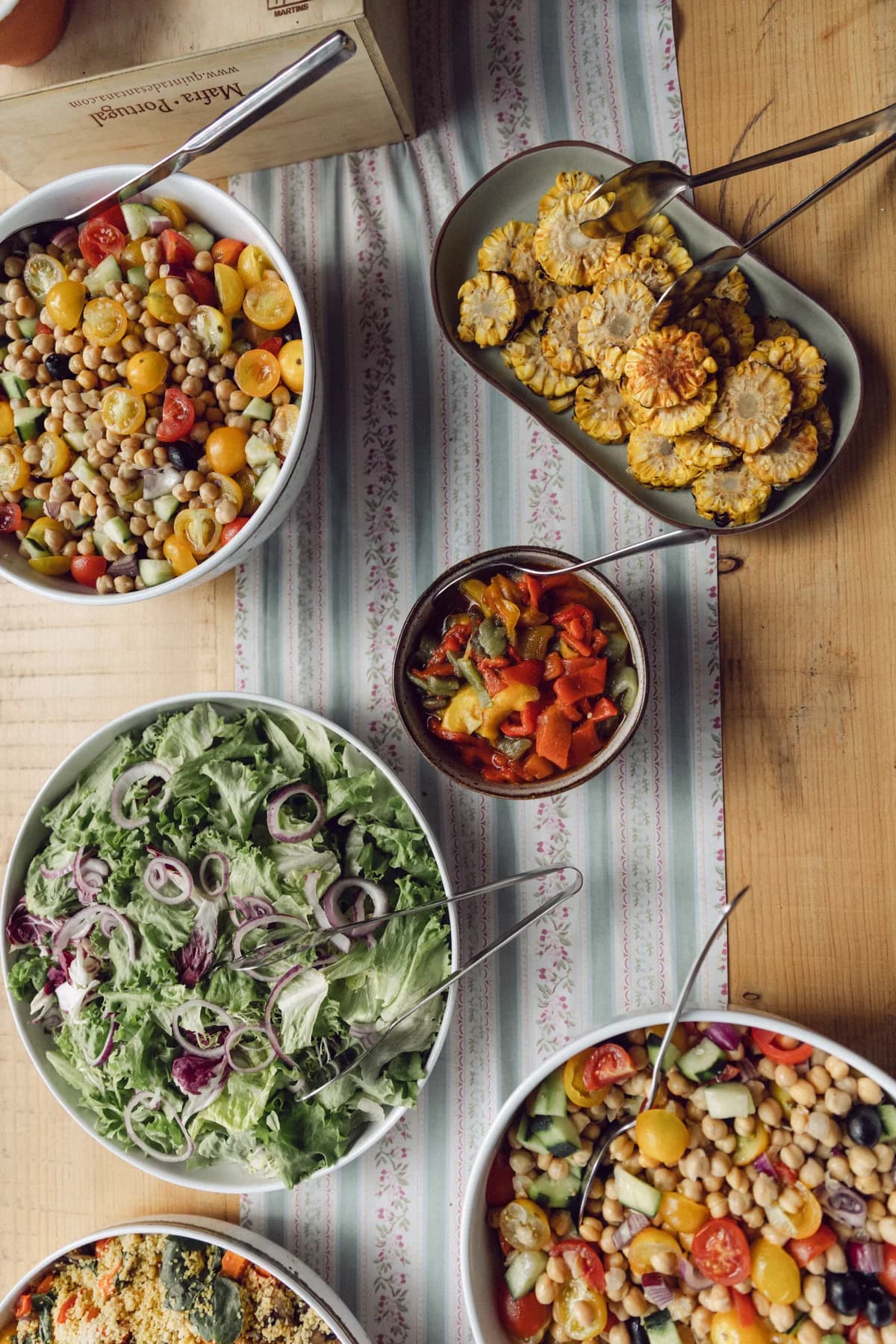 Bowls of colourful salads and vegetables ready to share