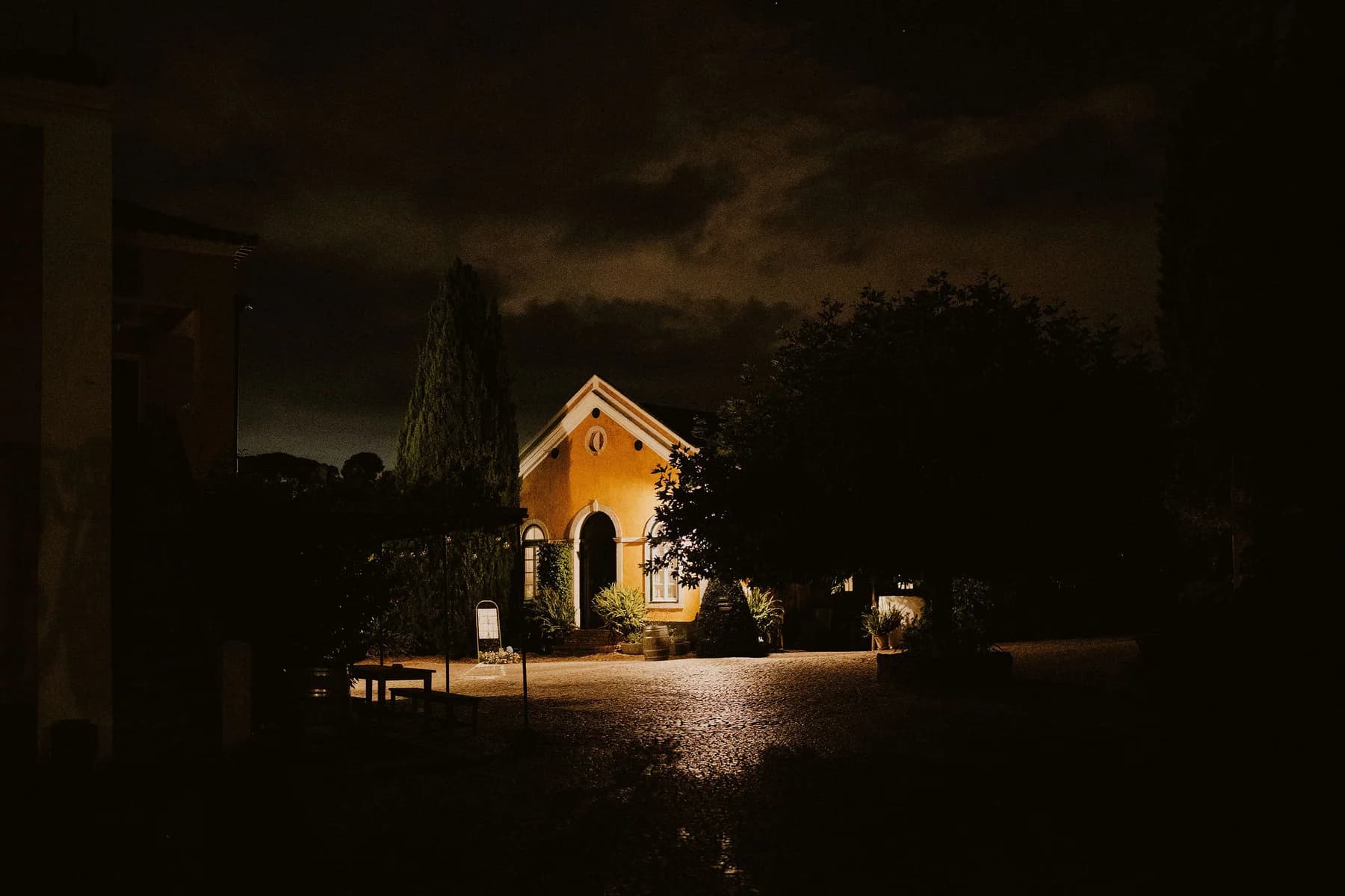 The illuminated chapel beneath the night sky