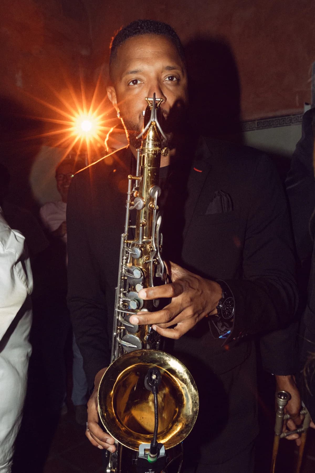 A saxophonist performing at the evening celebration