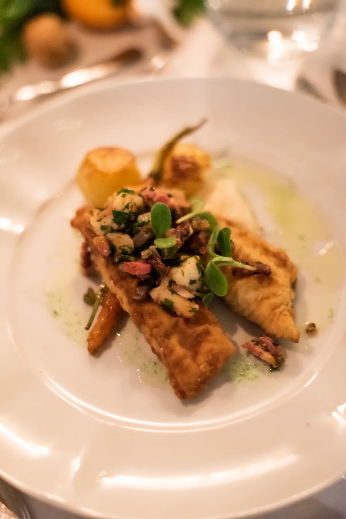 A plated main course with vegetables and sauce