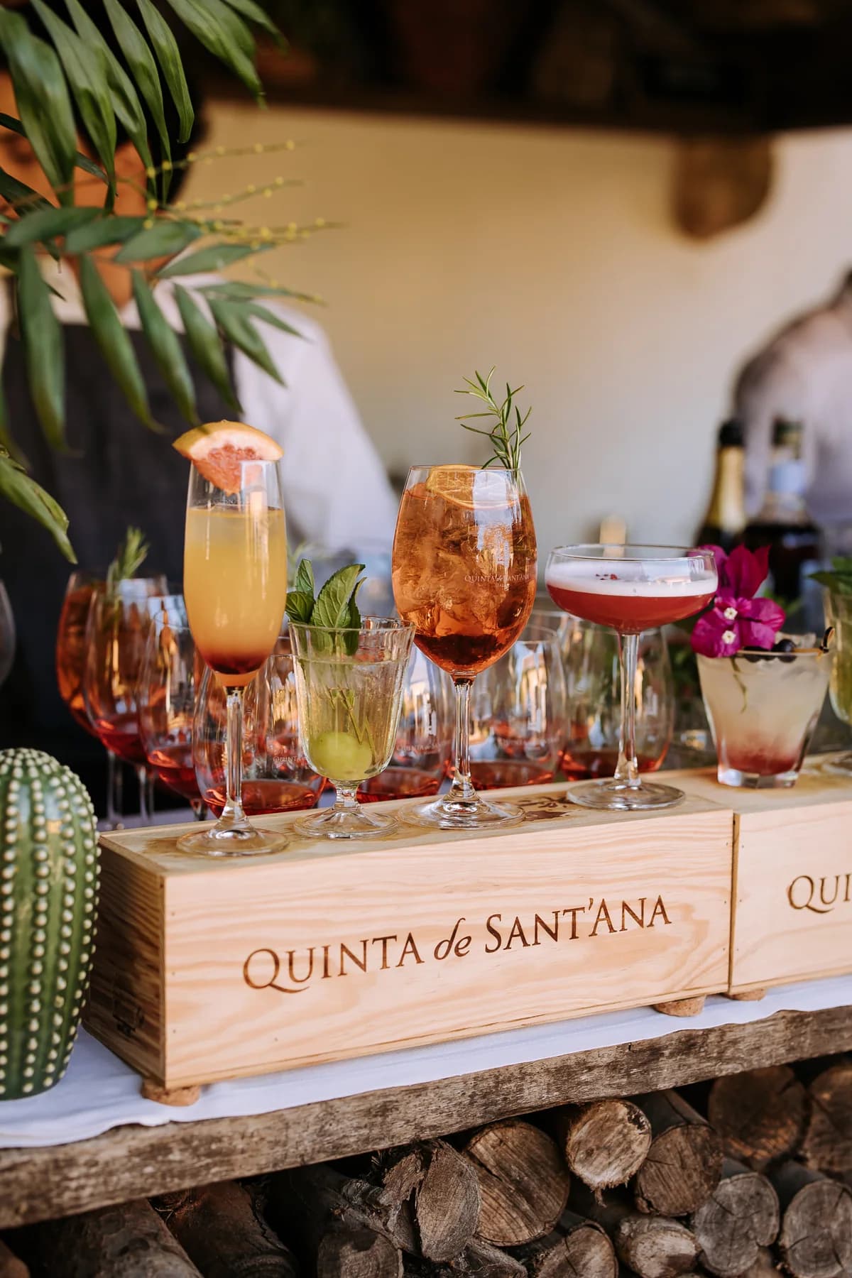 Colourful cocktails displayed in wooden estate wine crates