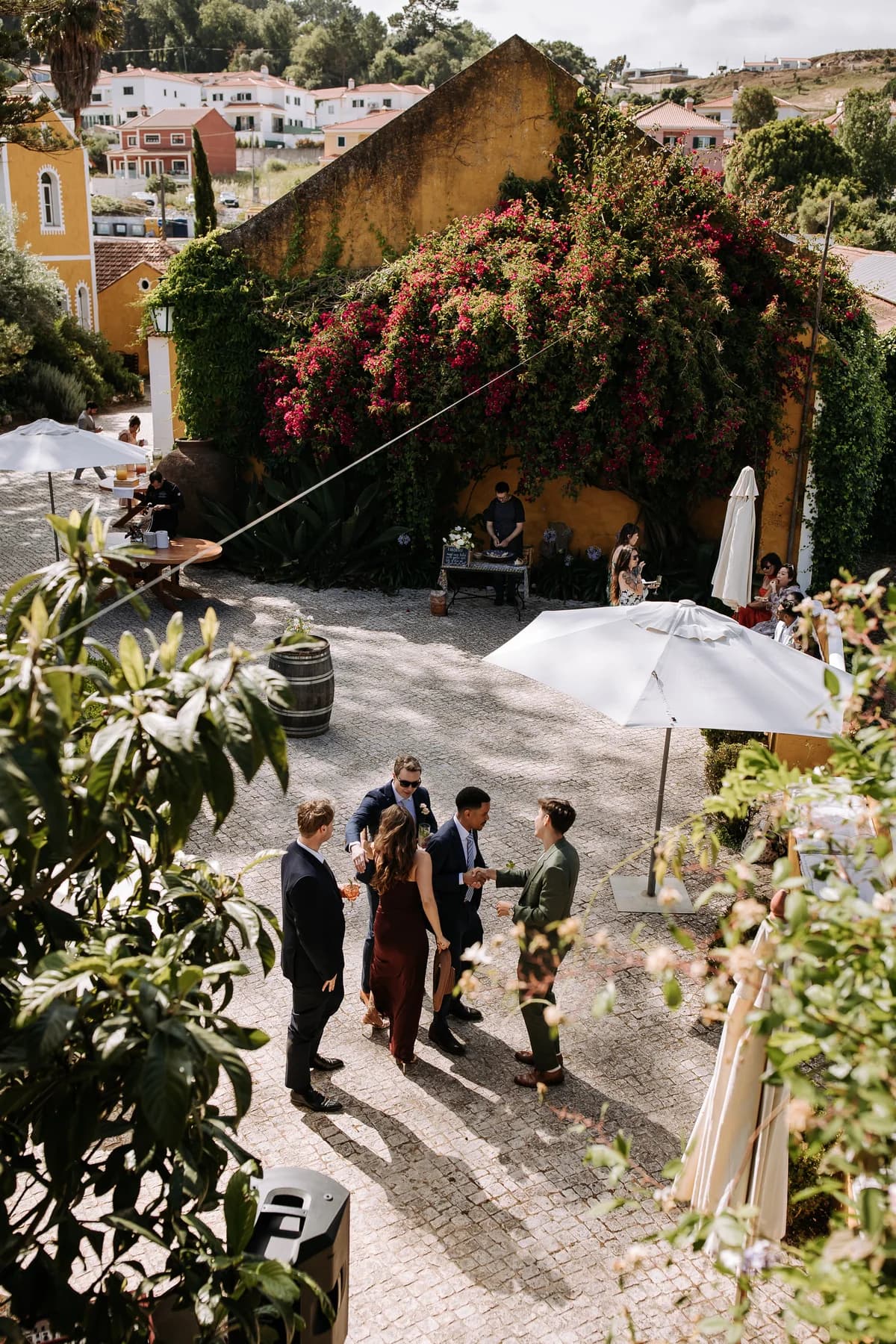 Guests gathering in the courtyard for welcome drinks