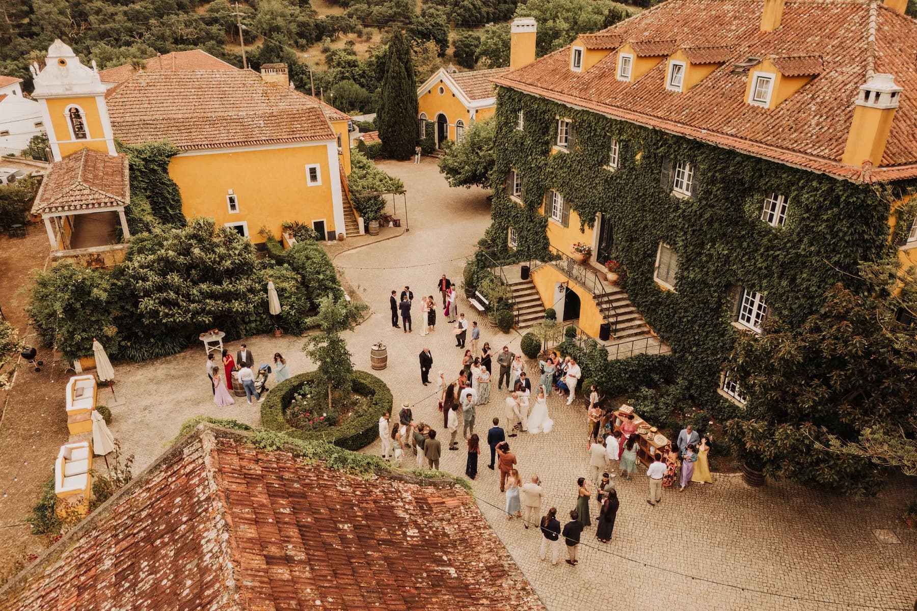 Guests mingling around the courtyard fountain