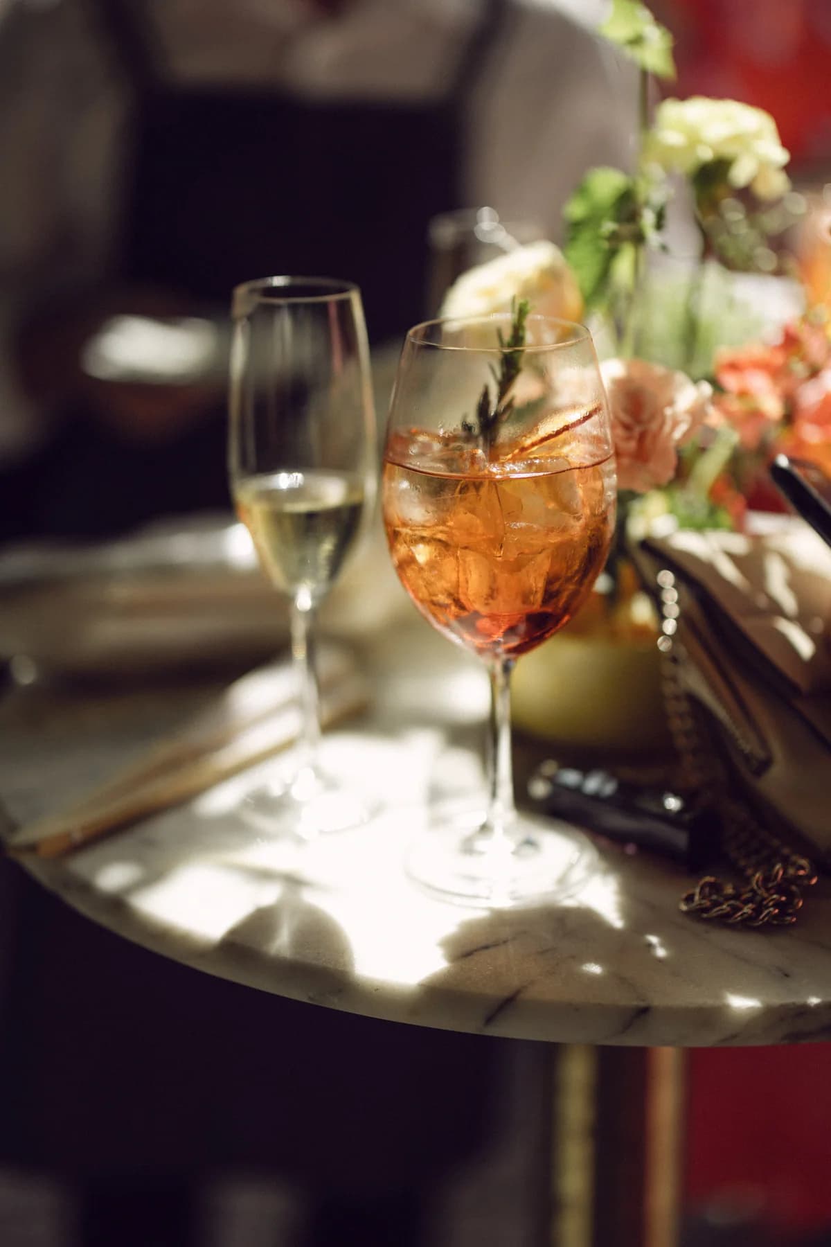 Wine and a cocktail on a tray at the reception