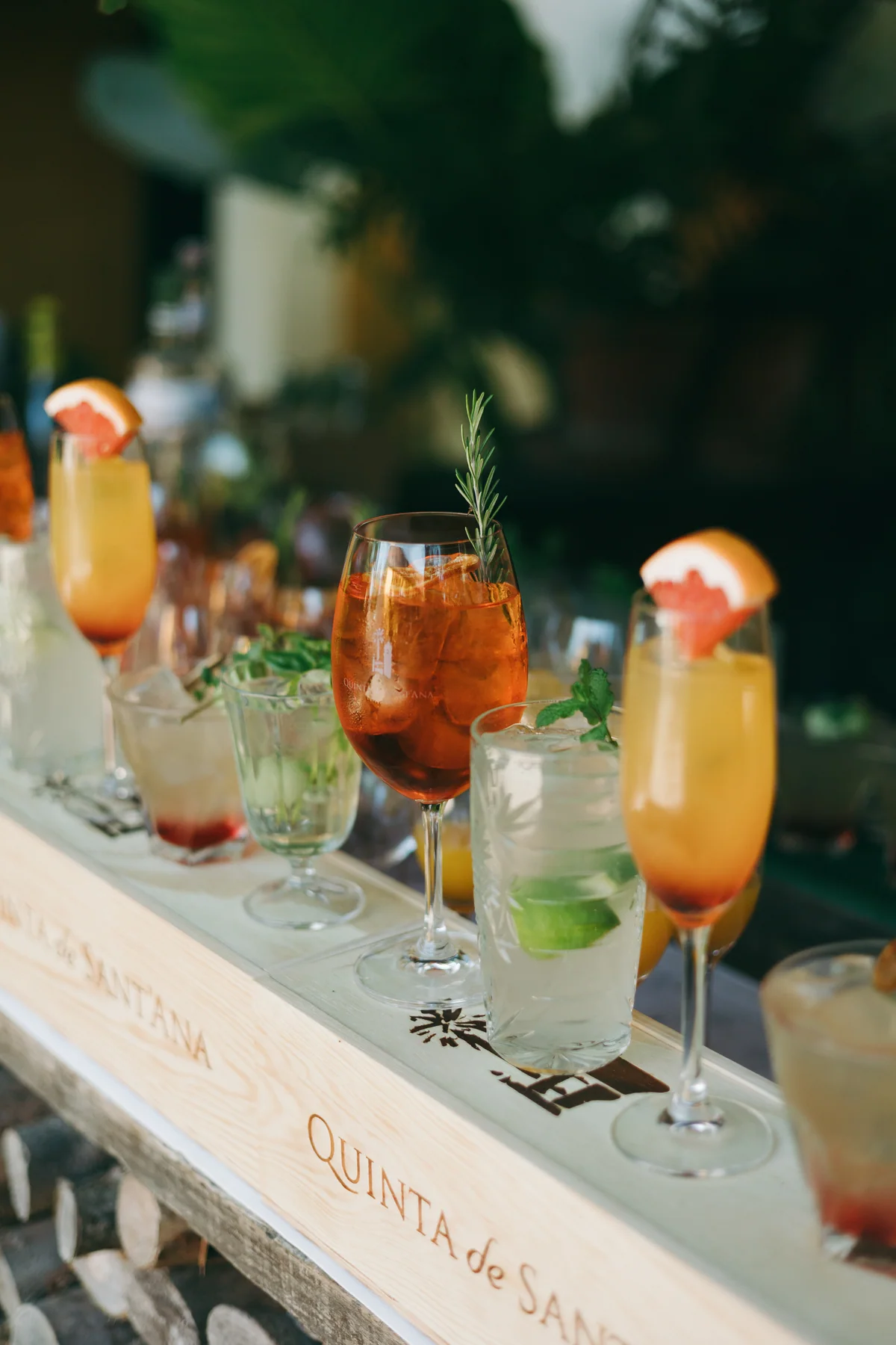 Fruit-garnished cocktails in an estate wine crate
