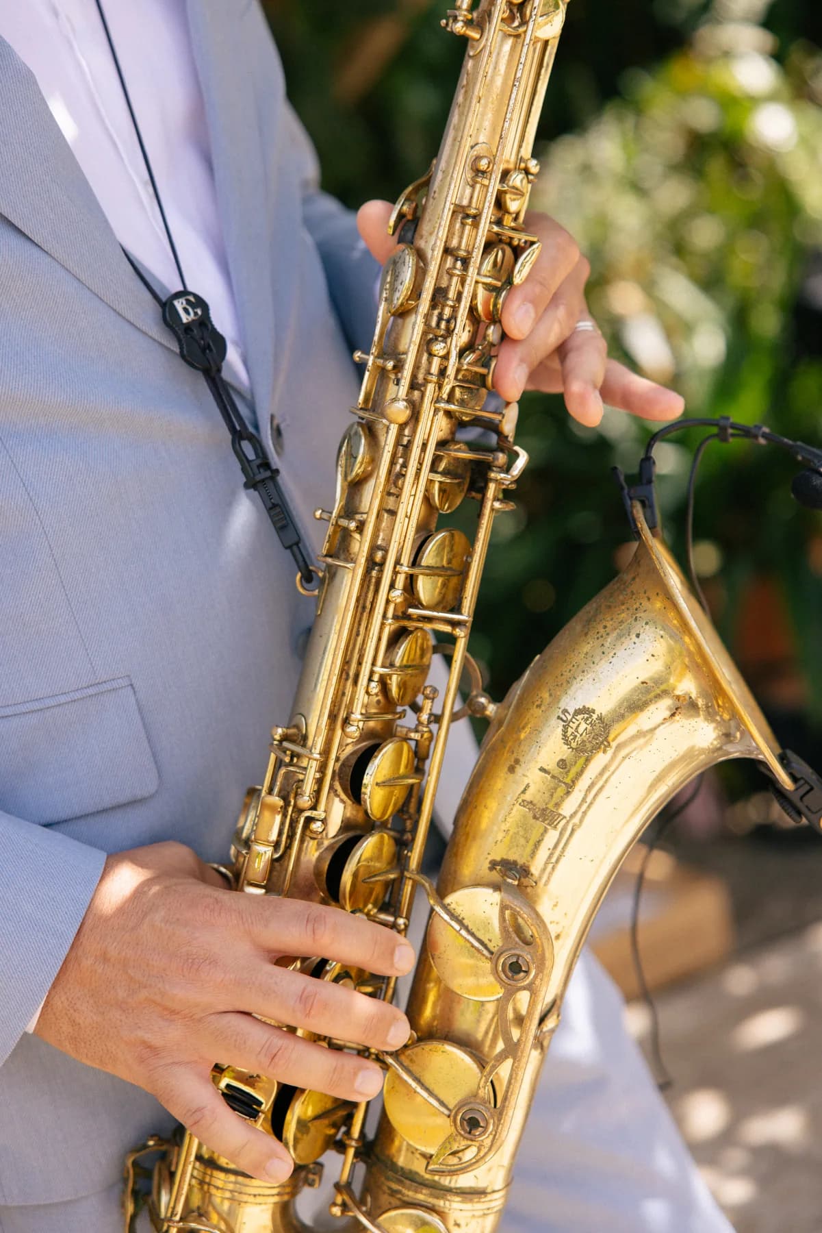 A saxophonist playing during the drinks reception