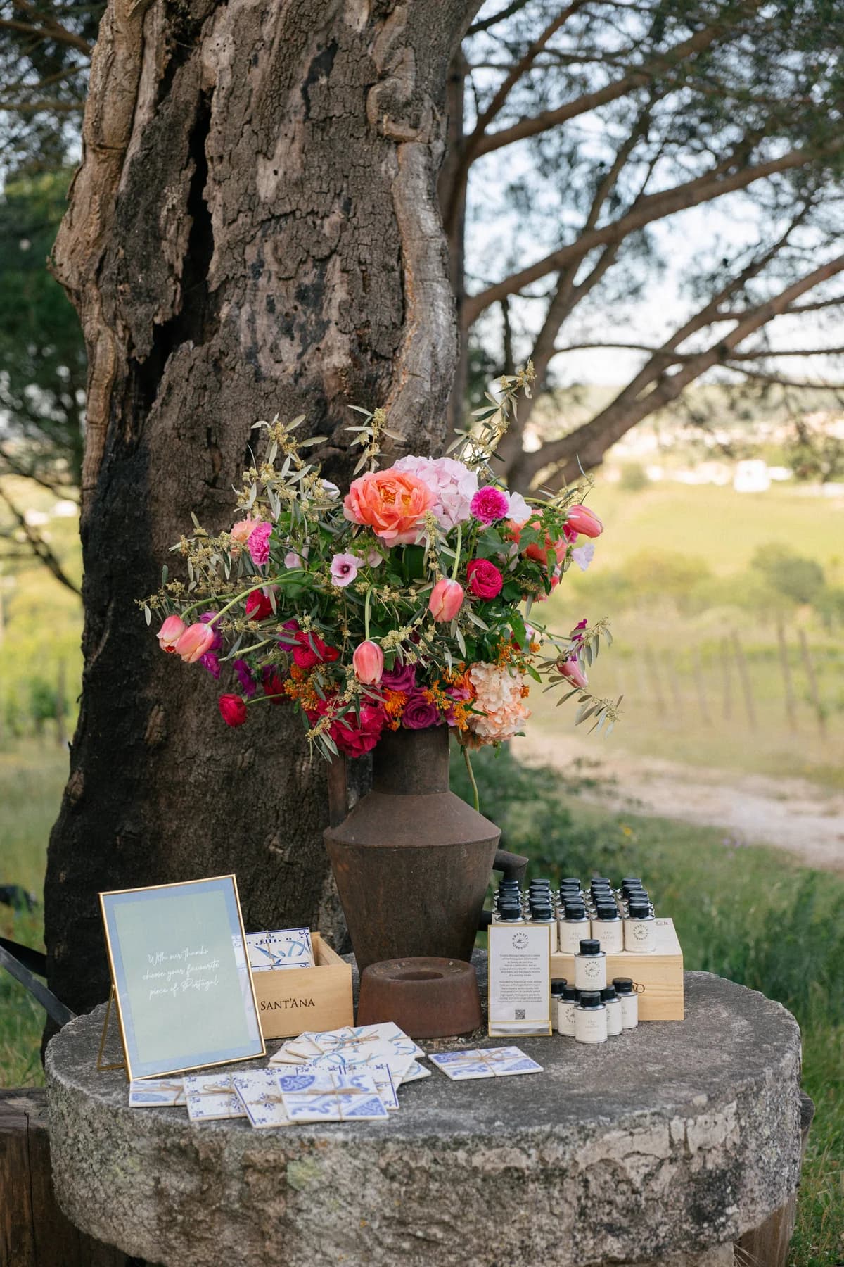 Flowers and welcome gifts displayed on a stone table