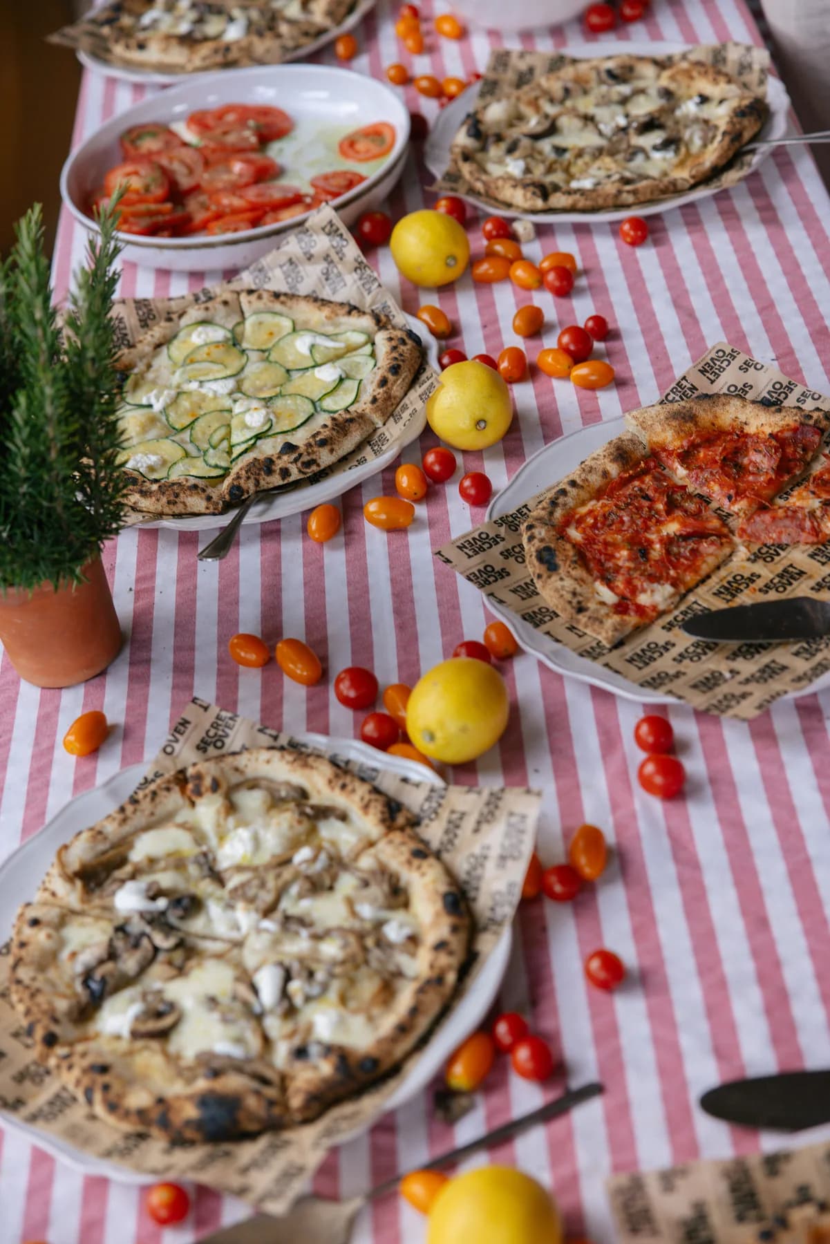 Pizzas and salads laid out for the welcome dinner