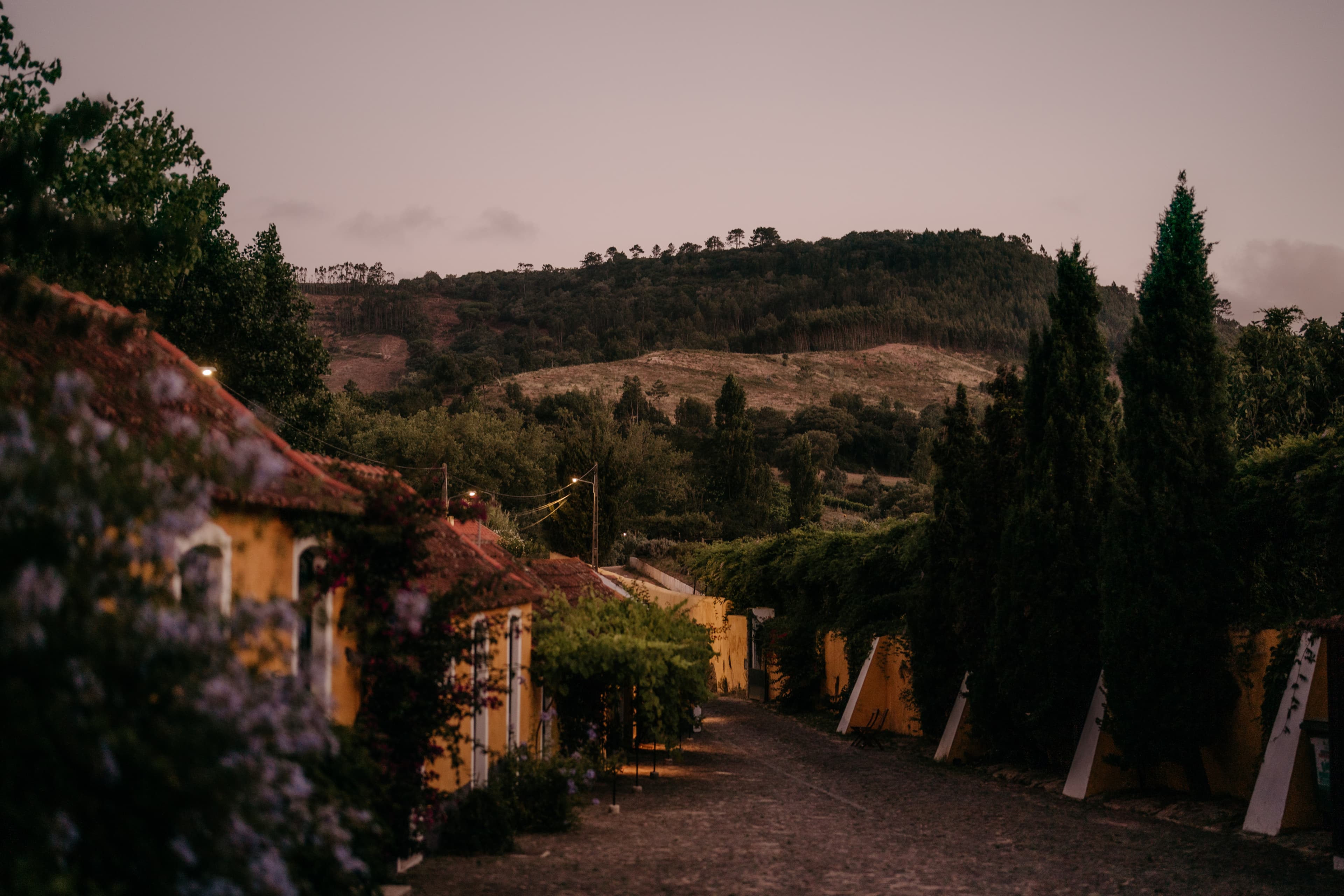 The old stable buildings and cobbled courtyard at dusk