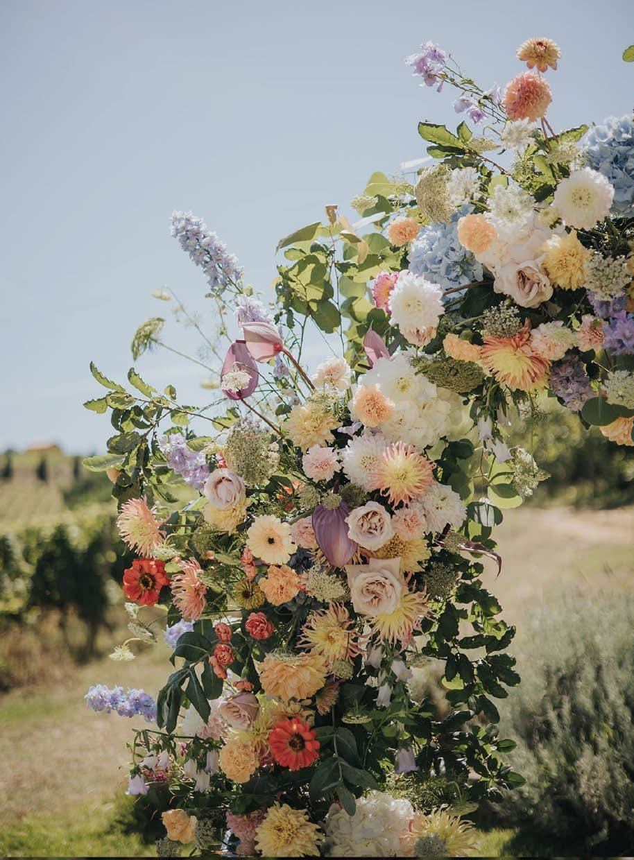 Floral arch at a vineyard ceremony