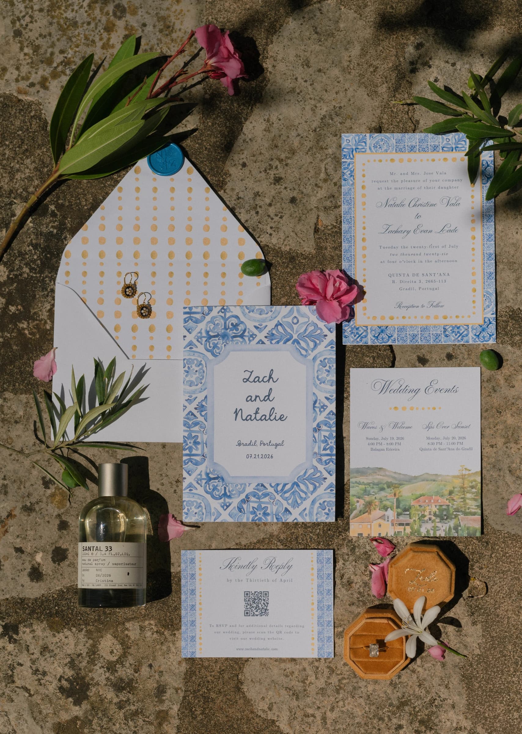 A wedding stationery suite with blue borders and botanical illustrations