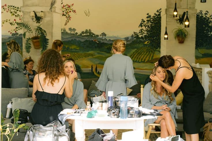 Makeup artists helping the bridal party get ready together at the Quinta