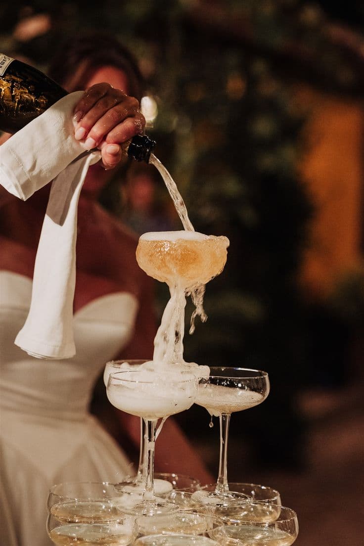 Champagne tower being poured
