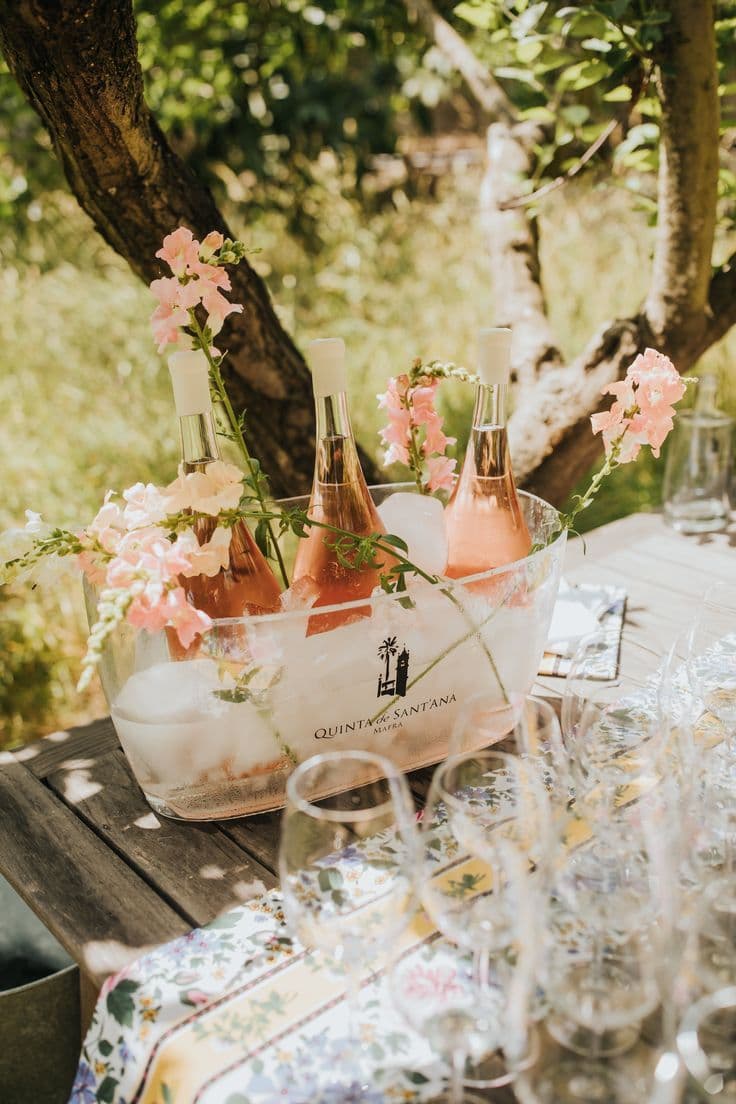 Wine chilling in a bucket among the vines